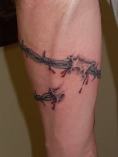 Ripped Skin Barbed Wire Tattoo On Sleeve